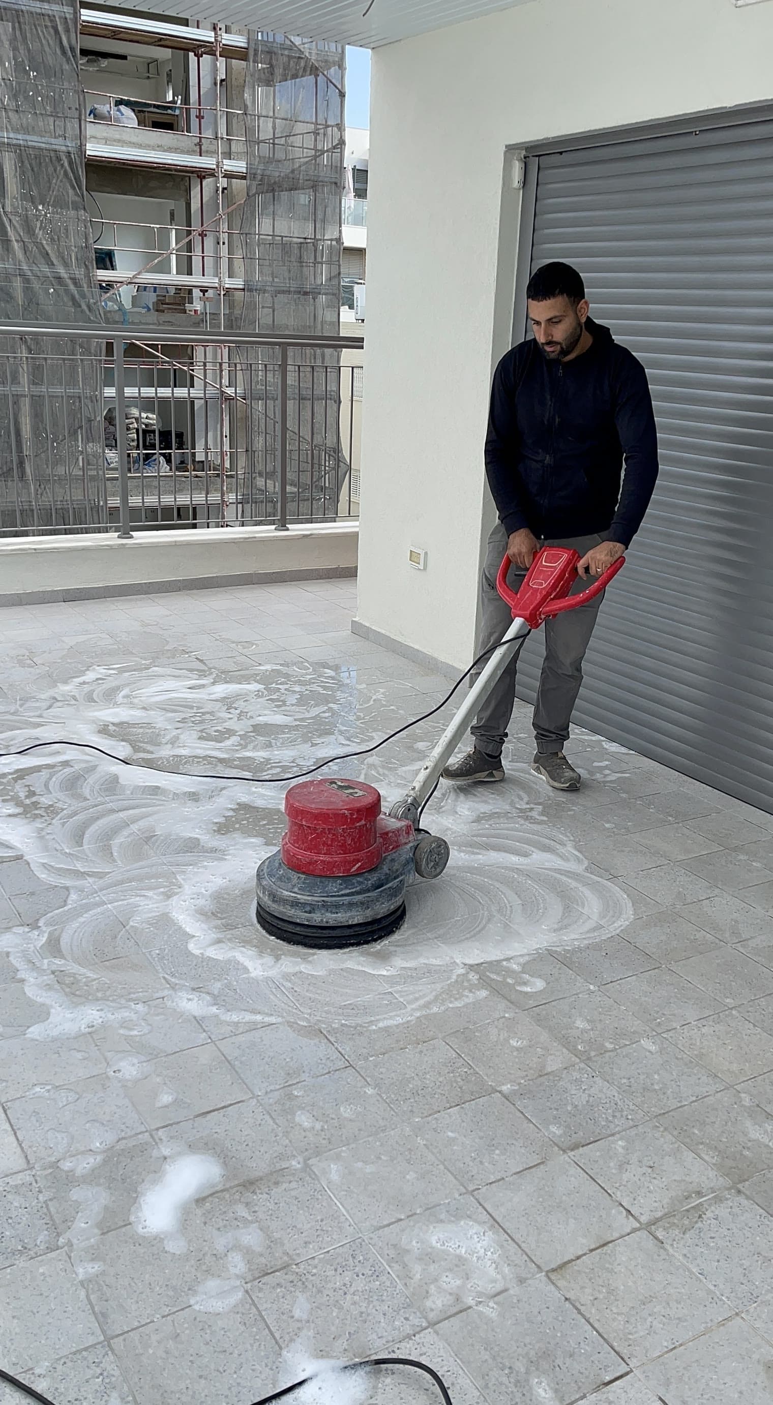 Hamudi on site cleaning the floor
